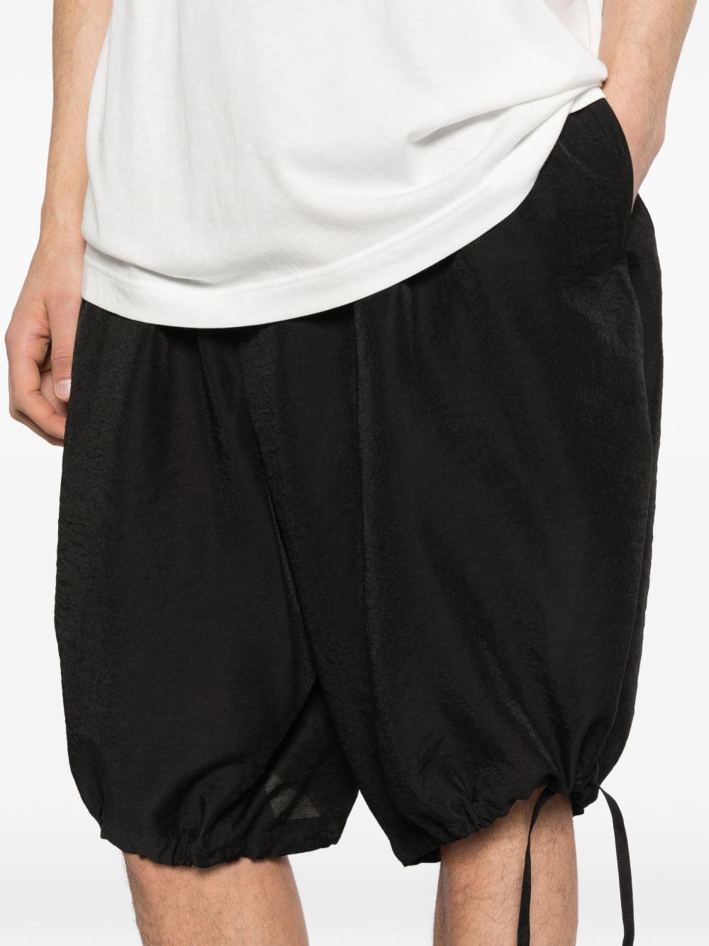Shorts con orlo a coulisse in nero Yohji yamamoto - uomo 