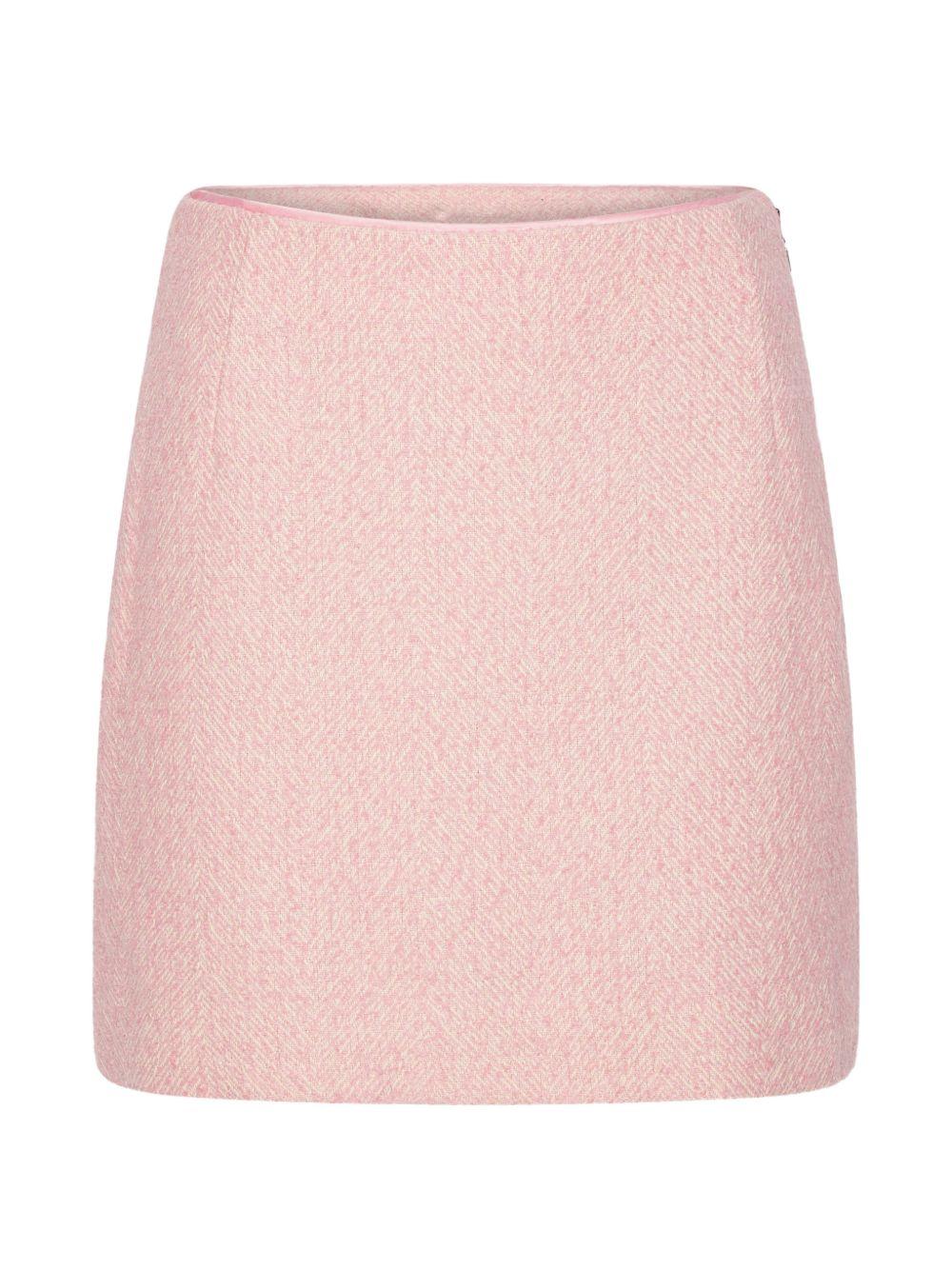 Gonna mini boucle in rosa 