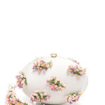 Clutch ovale con fiori in crema 