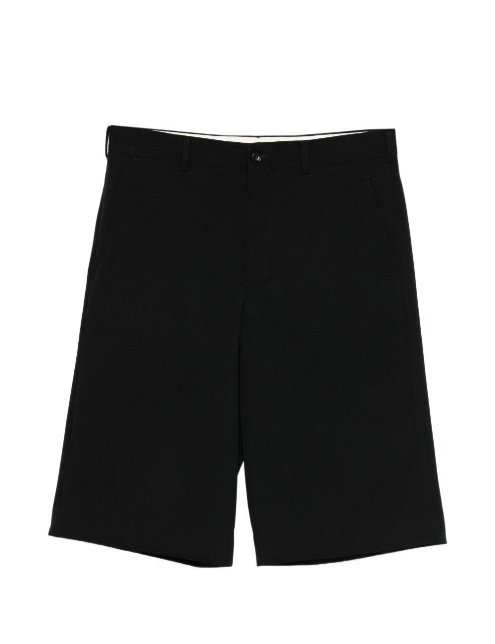 Pantaloni corti con bottoni in nero Comme des Garçons Homme Plus - uomo 