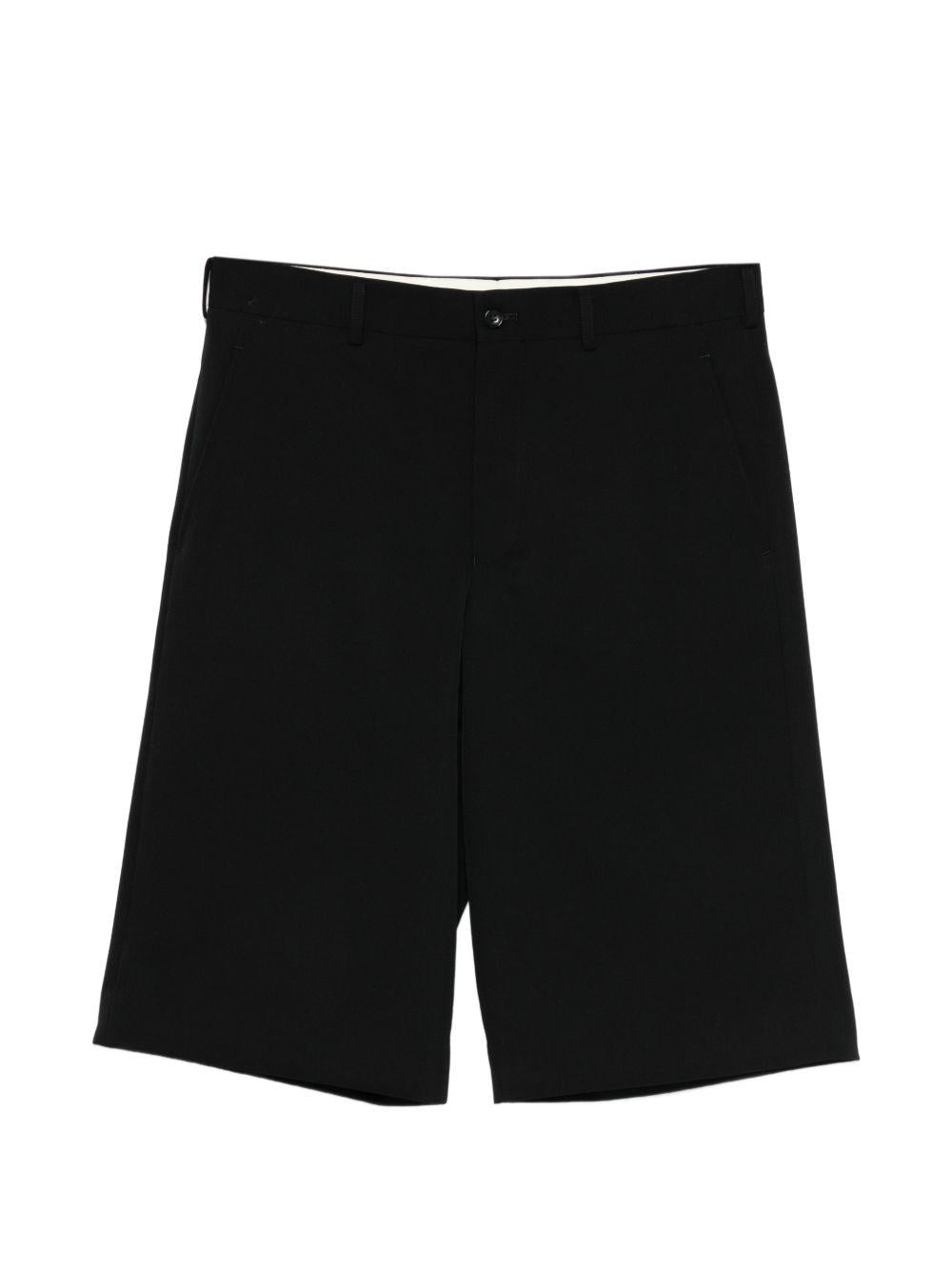 Pantaloni corti con bottoni in nero Comme des Garçons Homme Plus - uomo 