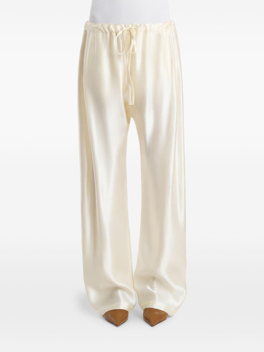 Pantaloni Rohen satinati in avorio Khaite - donna 