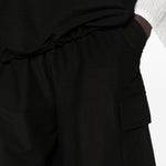 Pantaloncini cargo con coulisse in nero Comme des garcons homme - uomo 