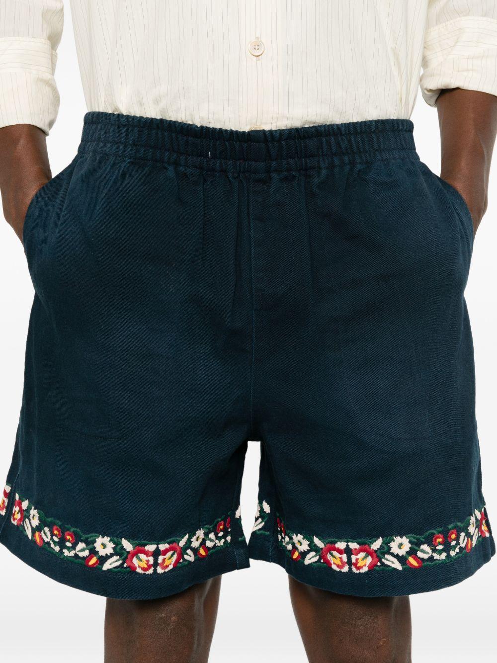 Shorts in twill con ricami floreali in blu Found - uomo 