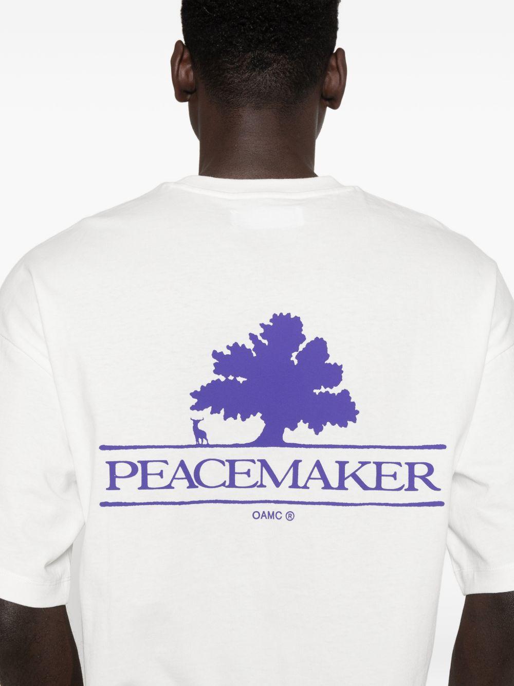 T-shirt con stampa del logo in bianco Oamc peacemaker - uomo 