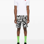 Polo con applicazione in bianco Comme des garcons play - uomo 