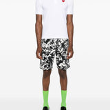 Polo con applicazione in bianco Comme des garcons play - uomo 