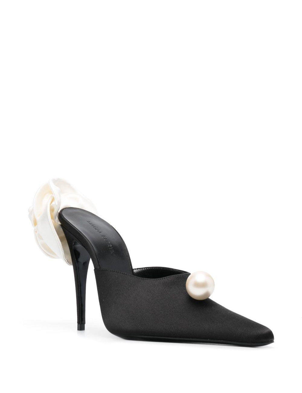 Mules con dettaglio a fiore in nero 