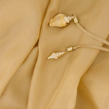 Abito lungo con cut-out Mahon in beige 
