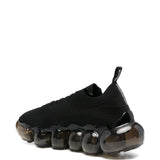Sneakers con suola a bolle in nero Undercover - uomo 
