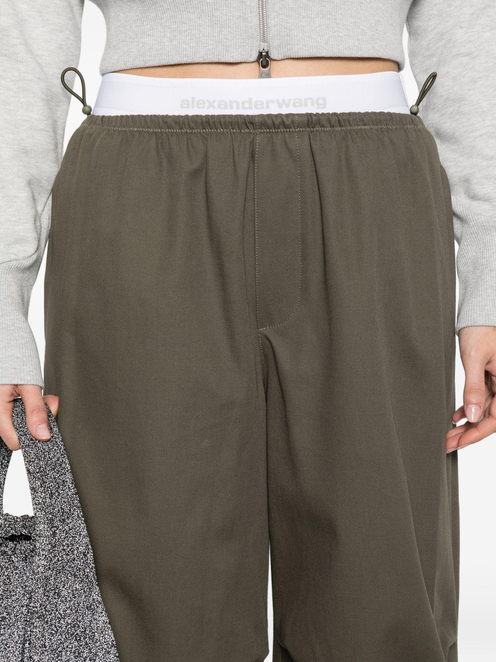Pantaloni con cintura a doppio strato e logo in verde Alexander wang - donna 