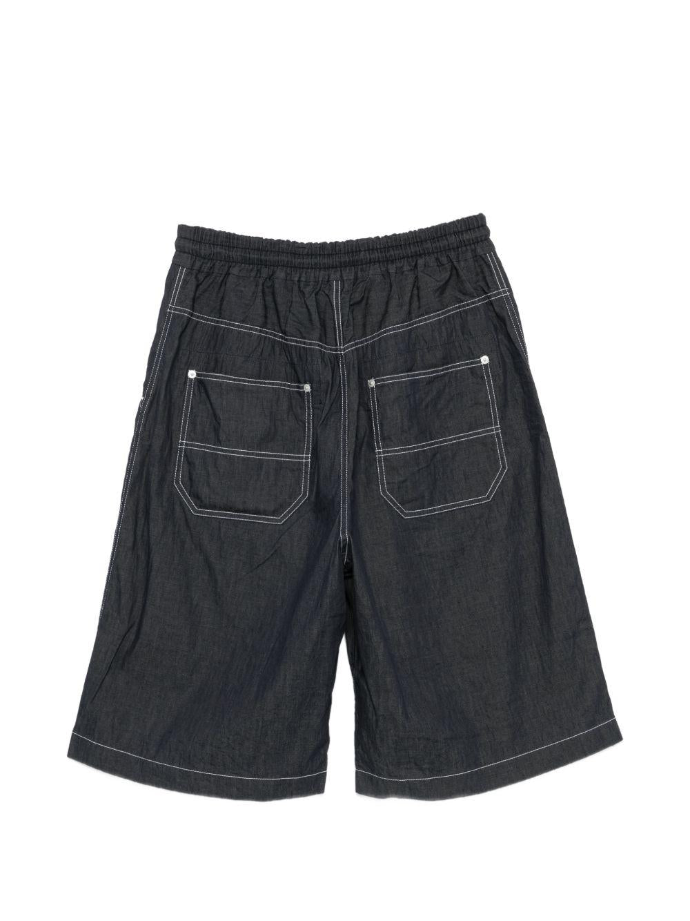 Pantaloncini con cuciture a contrasto in blu Comme des garcons homme - uomo 