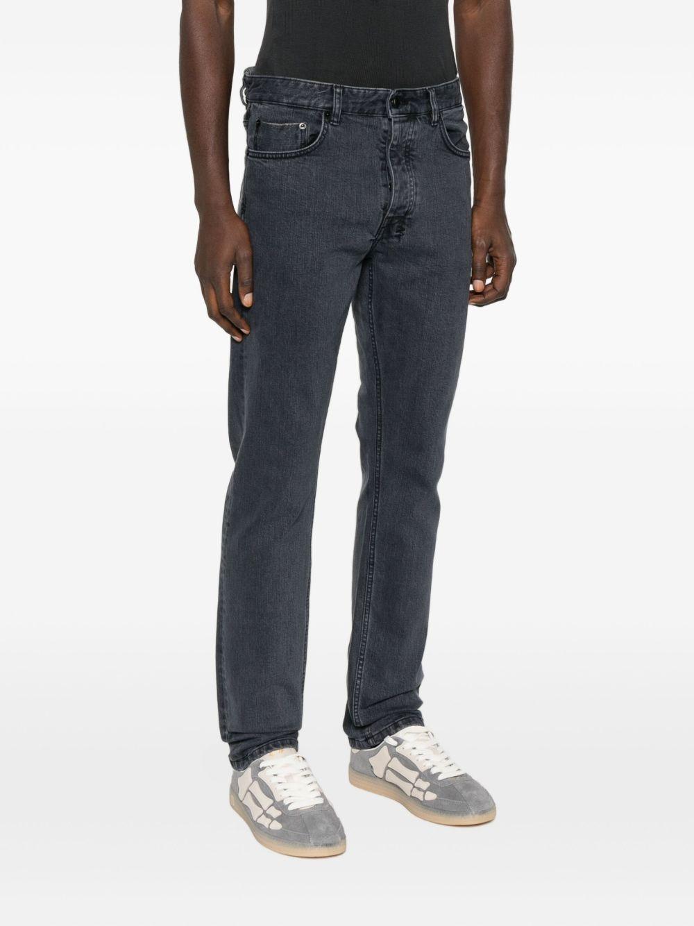 Jeans dritti con patch a bottoni in blu Ksubi - uomo 
