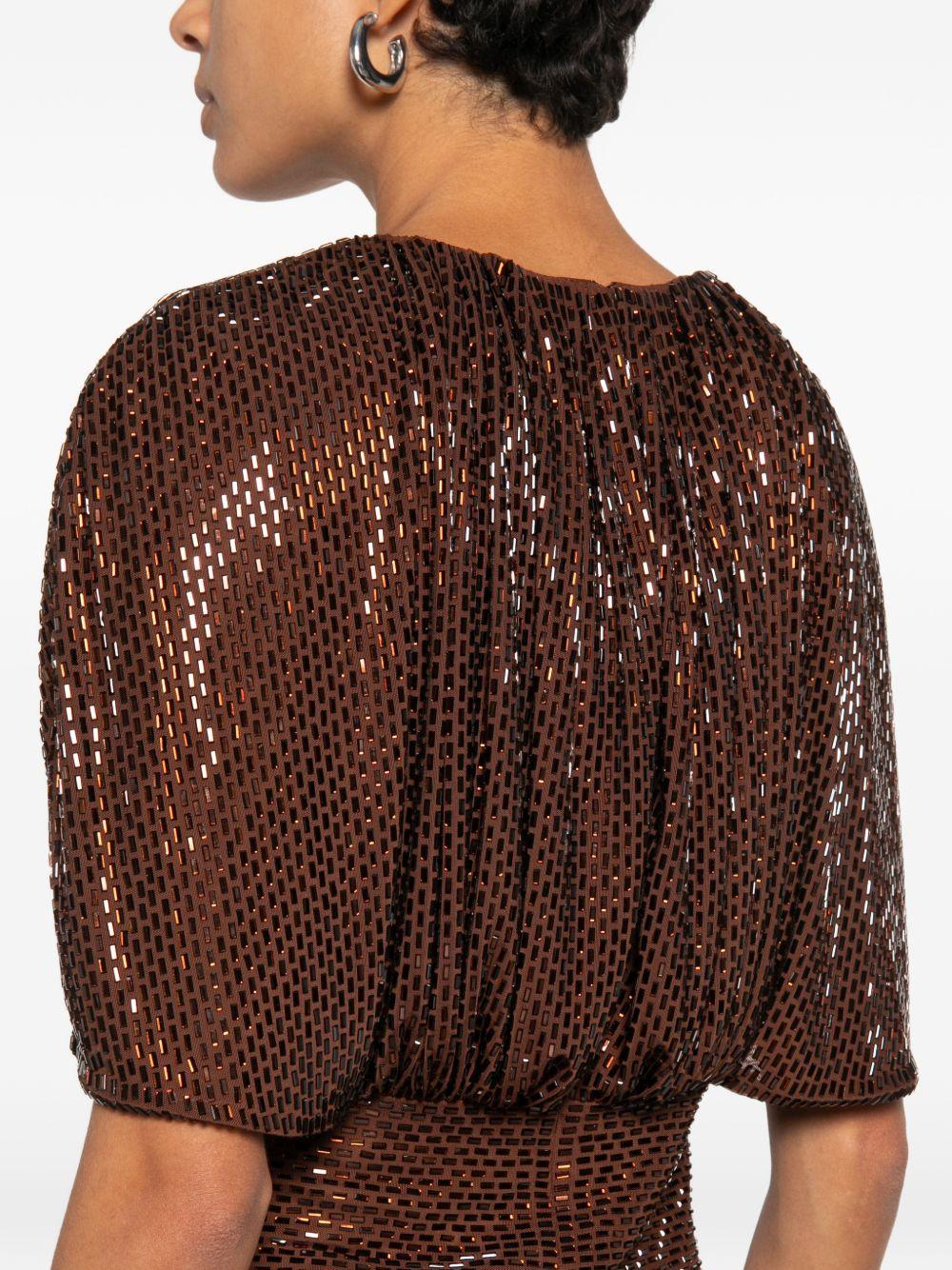 Top arricciato decorato con paillettes 