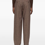Pantaloni a righe con design patchwork  in marrone Kidsuper - uomo 