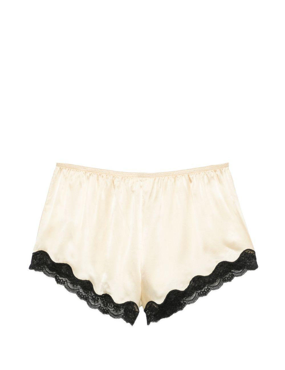 Pantaloncini con bordo in pizzo e fiocco decorativo in beige Rotate x love stories - donna 