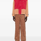 Pantaloni con motivo a scrittura ricamata in marrone Kidsuper - uomo 
