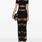 Abito polo semi trasparente a righe in nero Coperni - donna 