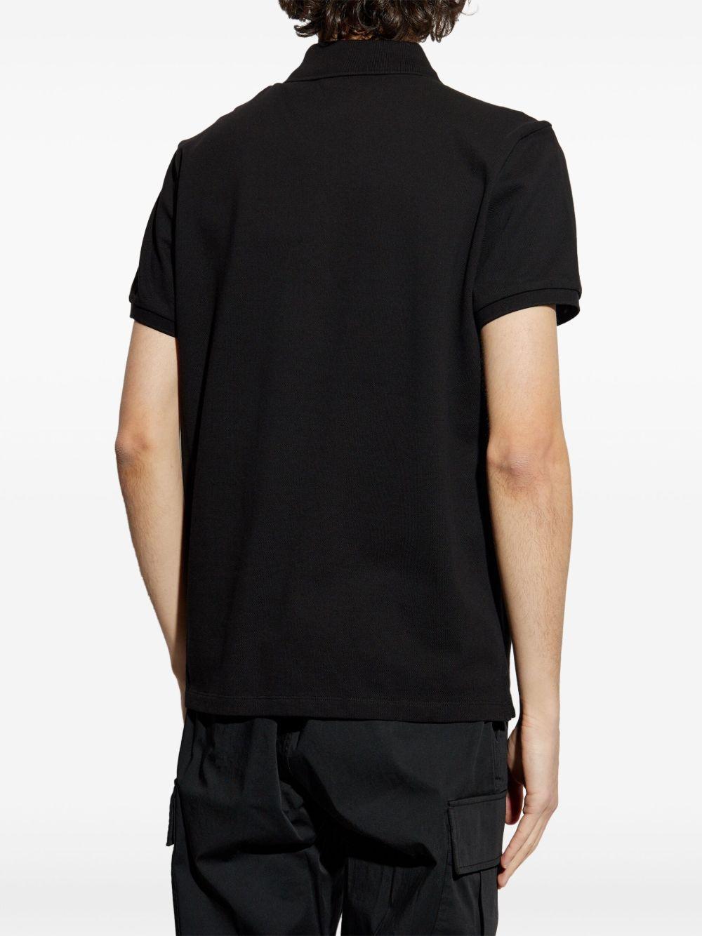 Polo con applicazione logo in nero Moncler - uomo 