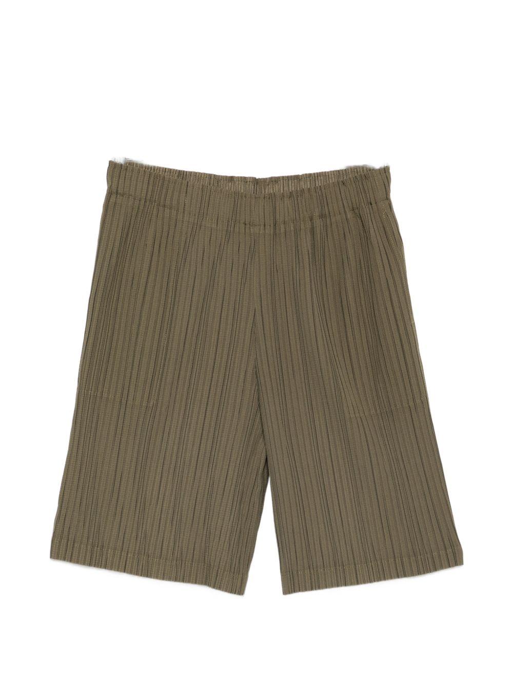 Pantaloncini elasticizzati con pieghe in verde Gongdid design - uomo 