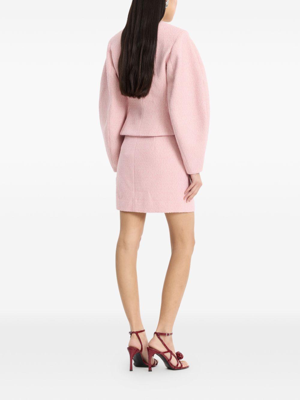 Gonna mini boucle in rosa 