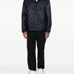 Piumino con cappuccio e logo in blu Moncler - uomo 