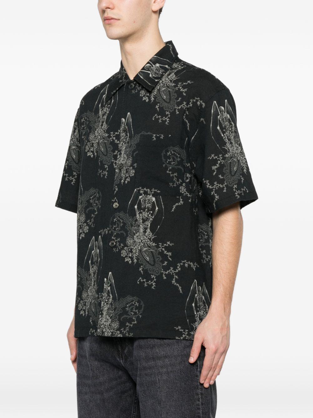 Camicia a maniche corte con fantasia in nero Our legacy - uomo 