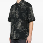 Camicia a maniche corte con fantasia in nero Our legacy - uomo 