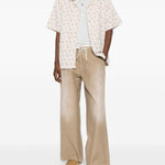 Pantaloni con passanti per cintura in beige Erl - unisex 
