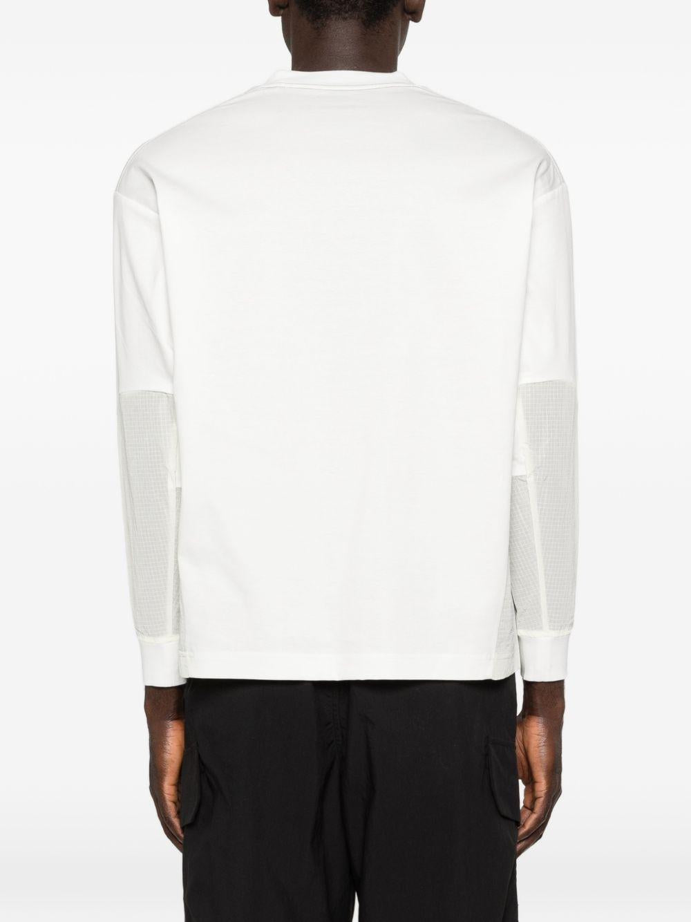 T-shirt a maniche lunghe con tasca in bianco And wander - uomo 