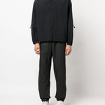 Pantaloni elasticizzati con coulisse in nero Rains - donna 