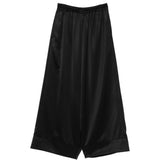 Pantaloni a gamba ampia con finitura satinata in nero Junya watanabe - donna 
