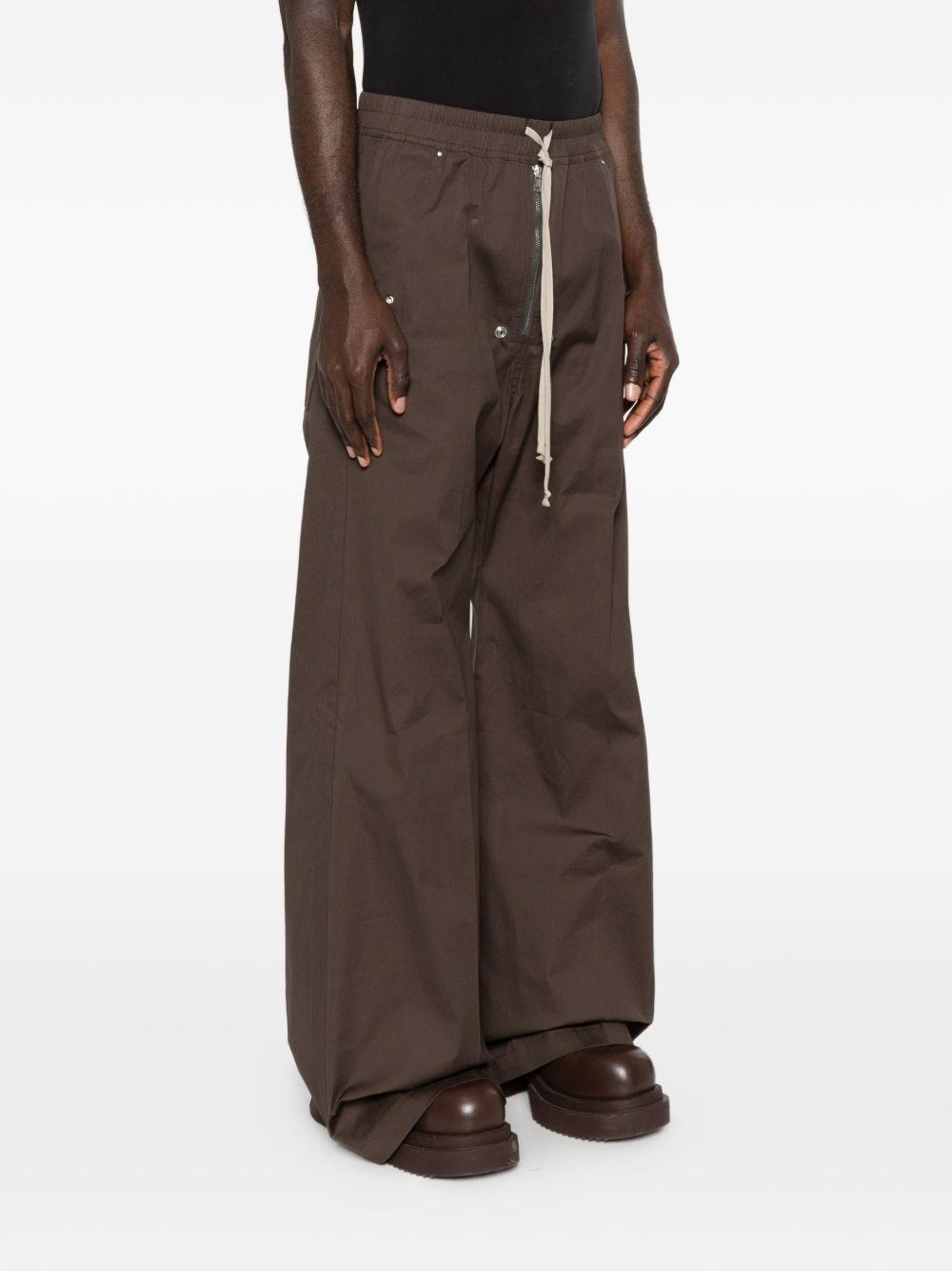 Pantaloni con dettaglio zip in grigio Rick owens - uomo 