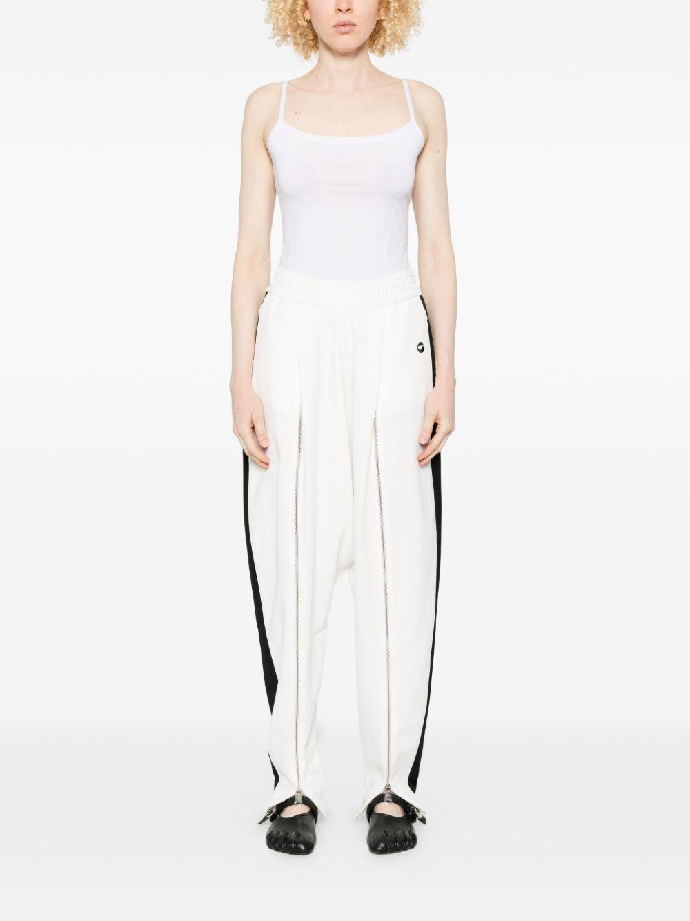 Pantaloni con zip in bianco Coperni - donna 