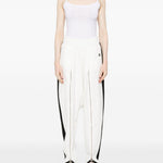 Pantaloni con zip in bianco Coperni - donna 