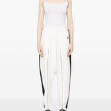Pantaloni con zip in bianco Coperni - donna 