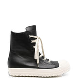 Sneakers alte in pelle in nero 