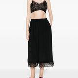 Top corto in pizzo floreale in nero Simone rocha - donna 