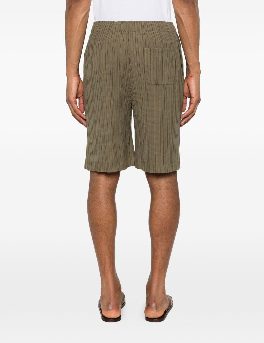 Pantaloncini elasticizzati con pieghe in verde Gongdid design - uomo 