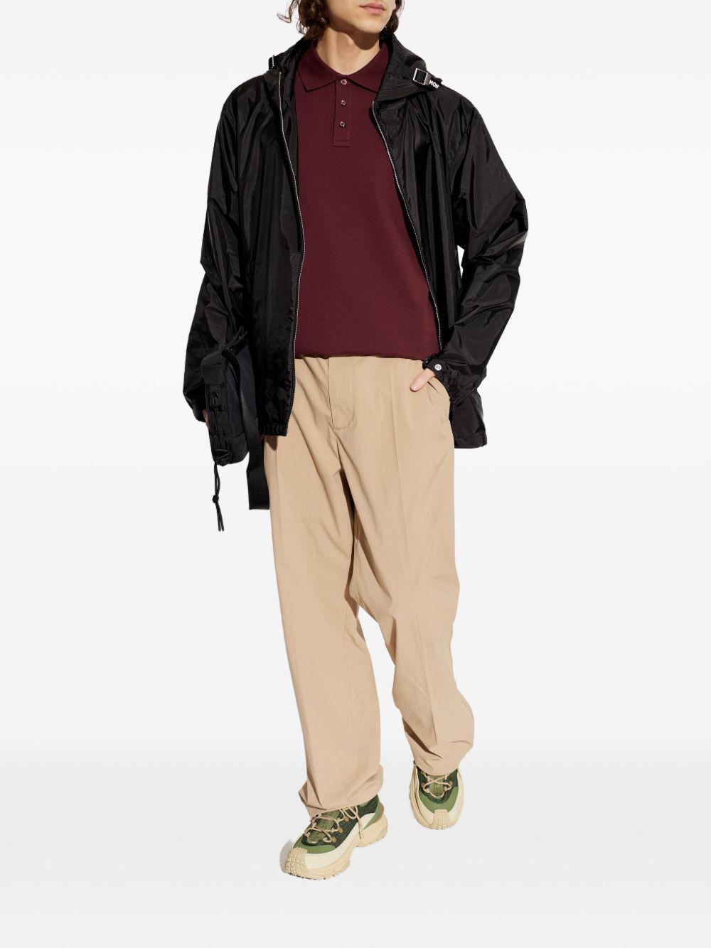 Polo con dettaglio a righe in piquet in rosso Moncler - uomo 