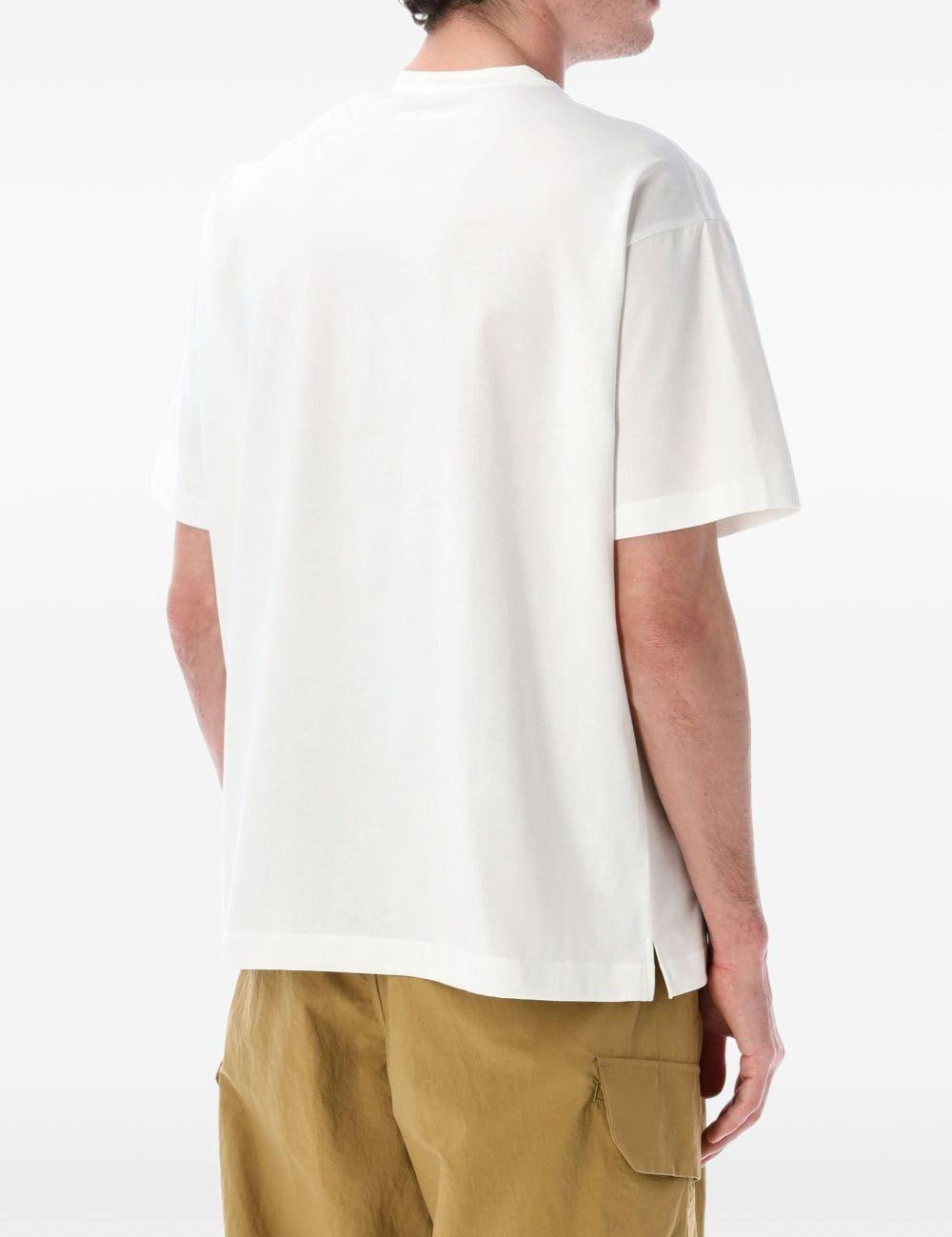 T-shirt con tasca a patta in bianco And wander - uomo 