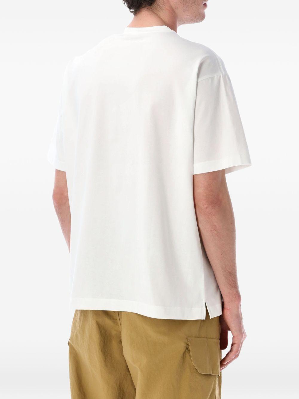 T-shirt con tasca a patta in bianco And wander - uomo 
