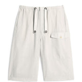 Shorts con tasca cargo in beige Lemaire - uomo 