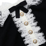 Polo con colletto in pizzo in nero 