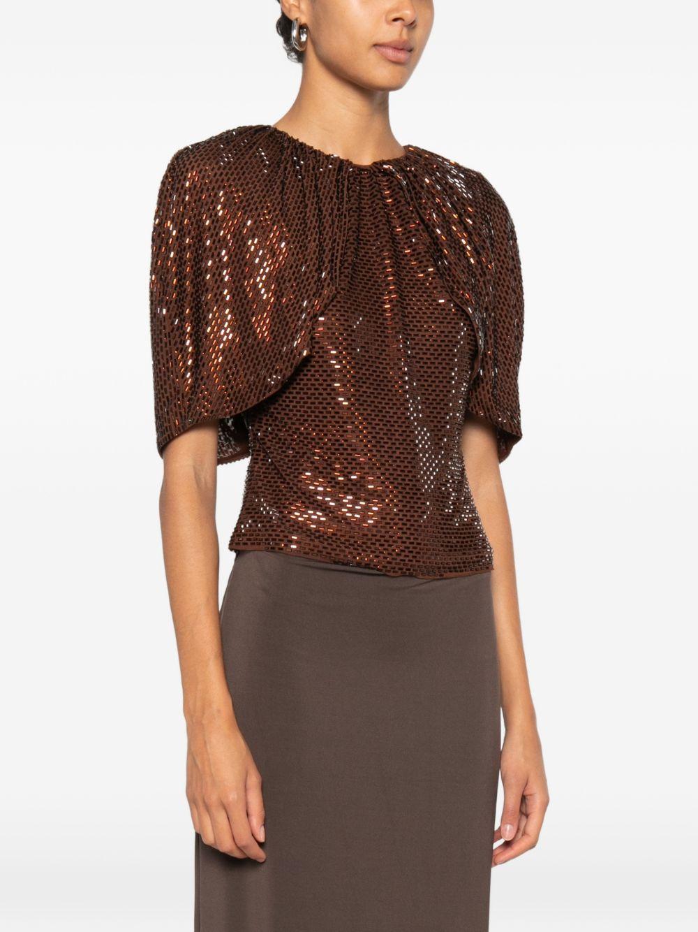 Top arricciato decorato con paillettes 