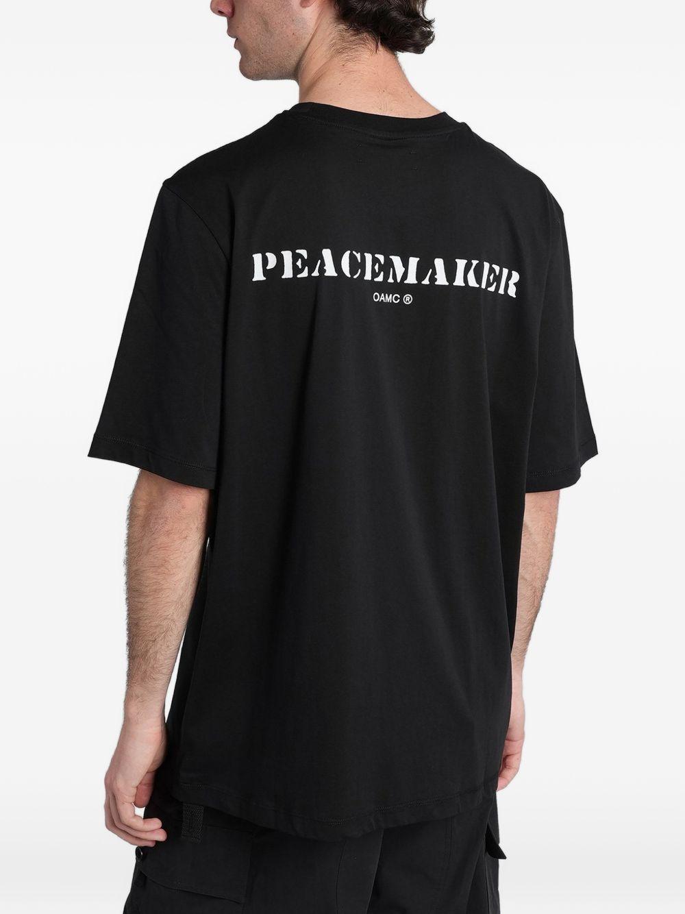 T-shirt con stampa del logo in nero Oamc peacemaker - uomo 