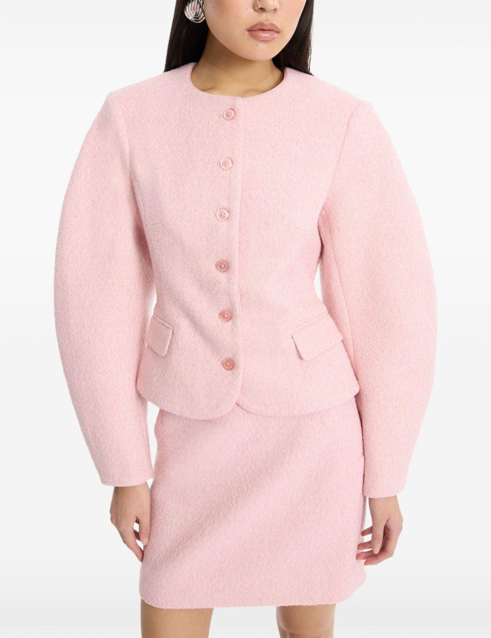 Gonna mini boucle in rosa 