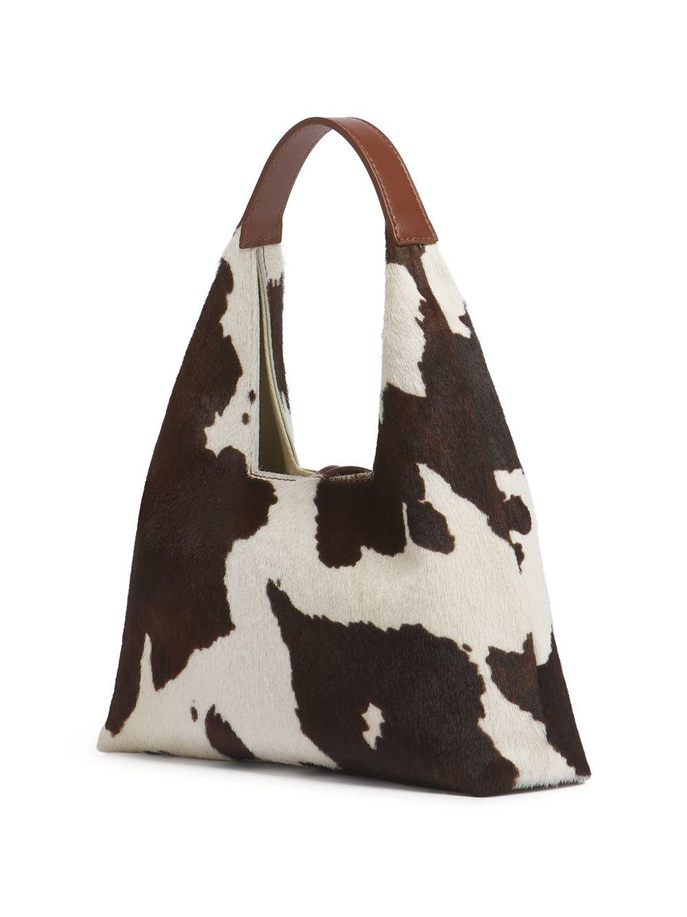 Borsa a spalla con stampa mucca Trapeze in bianco e marrone 