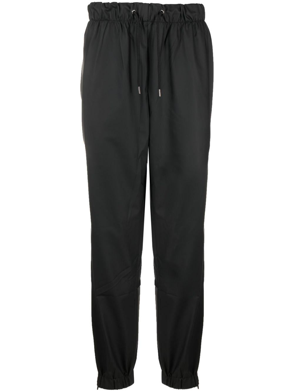 Pantaloni elasticizzati con coulisse in nero Rains - donna 