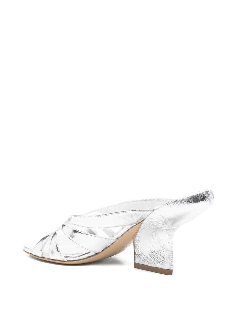 Mules con tacco in pelle metallizzata in argento Dries van noten - donna 
